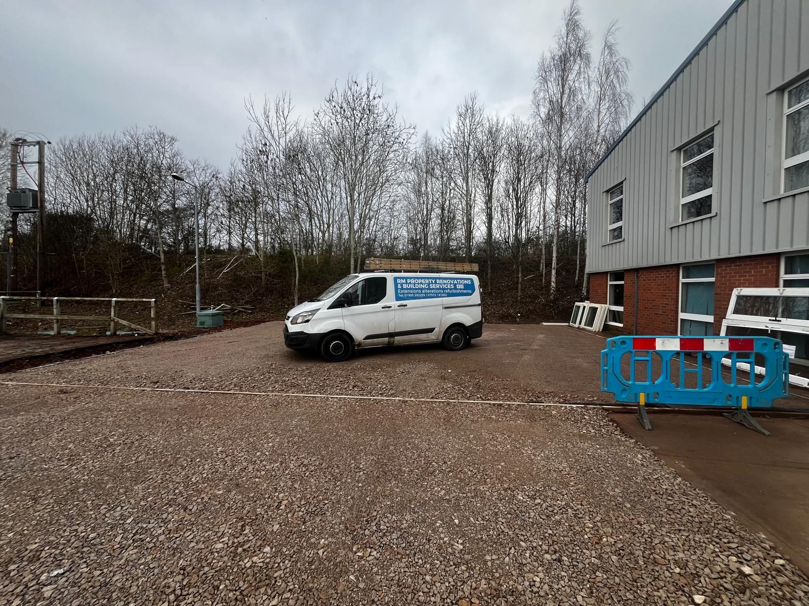 Compacted stone hard standing at a commercial unit