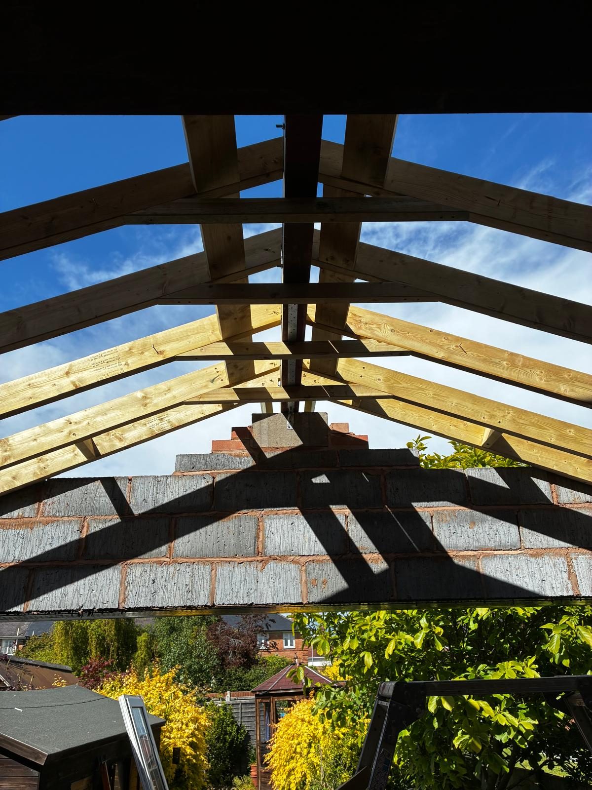New timber roof cut on site over a rear extension